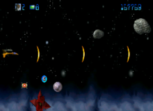 The player controls Trevor McFur's ship (left) and fires at approaching hazards. JAG Trevor McFur in the Crescent Galaxy.png