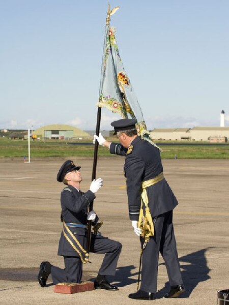 The 2622sqn RAuxAF Regiment standard is presented to an officer on 30 September 2006