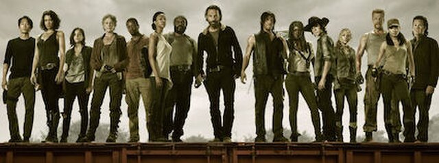 The primary characters of the fifth season include (from left to right): Glenn, Maggie, Tara, Carol, Bob, Sasha, Tyreese, Rick, Daryl, Michonne, Carl,