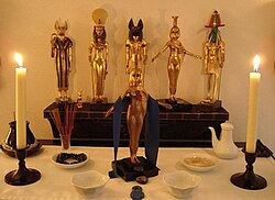 A Kemetic shrine, with statues of Bastet, Sekhmet, Anubis, Nephthys, Thoth, and Serket Mezaenaset's Senut Kemetic Shrine.jpg