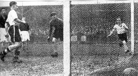 1936: Joe Payne (white shirt, left) scores one of his record-breaking 10 goals in one match
