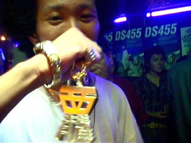 Japanese hip-hop fan sports an Afro and shows some Japanese style bling.