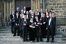 A group of Chorus members waits outside Ripon Cathedral before entering for a summer concert. LFC Ripon.jpg