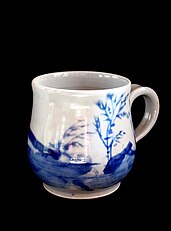 Mug with blue underglaze decoration on porcelain.