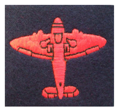 Red "Spitfire" proficiency badge, worn on both sleeves. (Blue [blue/grey] and Gold Spitfire badges were also awarded).