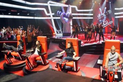 The Voice of the Philippines' coaches (from left to right): Bamboo Mañalac, Sarah Geronimo, Lea Salonga, and apl.de.ap sitting on their respective red