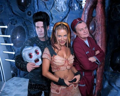 From left to right: McManus as Kai (holding 790), Seeberg as Xev Bellringer, and Downey as Stanley Tweedle