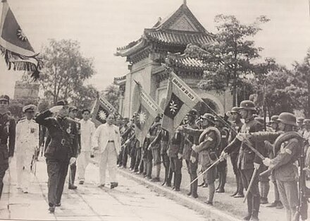 Wang Jingwei inspecting an honor guard during a parade, 1942. Note the officers holding swords as per the Japanese tradition