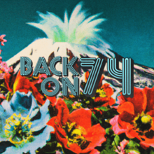 A scene from below a mountain in a field, with an explosion coming from the top of the mountain, and the title "Back on 74" superimposed in blue retro font