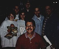 Irvan poses with fans while signing autographs The Santiagos and Ernie.jpg