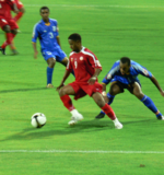 Omani footballer, Hashim Saleh in action for his team, Dhofar F.C. facing city rivals, Al-Nasr F.C