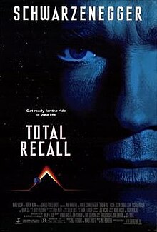 The film poster shows a close up of Arnold Schwarzenegger, with his last name on top and a pyramid shape glowing on top with planets near the bottom. The tagline reads "Get read for the ride of your life". Below the tagline is the film's name and the bottom contains a list of the film's credits.