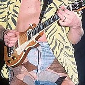 Eddie Van Halen with the custom mini-Les Paul in 1984. Eddie Van Halen - Little Guitars.jpg