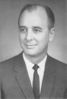 Black and white portrait of a man wearing a suit