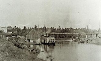 Timmens Landing (La Center, WA), circa 1919. La Center is larger steamer on right, Etna appears to be the smaller steamer on the left. Timmens Landing circa 1919.jpg