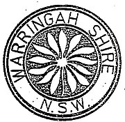 Warringah Shire Council Seal, featuring a flannel flower, adopted by the council following its establishment. First Warringah Shire seal.jpg