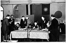 Wang Jingwei, Japanese ambassador Abe Nobuyuki, and Manchukuo ambassador Zang Shiyi sign the joint declaration, 30 November 1940 Signing of Japan-Manchukuo-China Joint Declaration.jpg