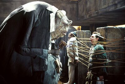 Prostetnic Vogon Jeltz of the Galactic Hyperspace Planning Council tortures Ford Prefect and Arthur Dent with his poetry in the 2005 film The Hitchhik