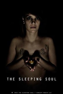 Promotional poster shows a woman with dark hair holding a candle out, in the dark. We see she is topless (but her hands are covering her breasts), with tattoos of some sort on her chest.