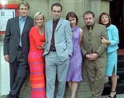 (from left): Robert Bathurst, Hermione Norris, James Nesbitt, Helen Baxendale, John Thomson, and Fay Ripley