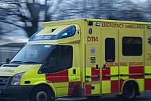 A Dublin Fire Brigade ambulance responding with flashing blue lights Dfbyellowamb.JPG