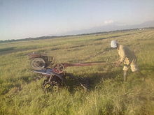 Farmář, který oruje na jednom z kalinaoských rýžových polí.