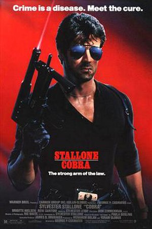 Against a red backdrop, Stallone dressed in black, holding a large gun, wearing sunglasses, and with a matchstick in his mouth.