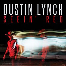 Un hombre cubierto de una luz roja.  Detrás de él hay una corriente de luz y una imagen duplicada de sí mismo.  El nombre del artista y el título de la canción aparecen arriba, coloreados en blanco y rojo respectivamente.