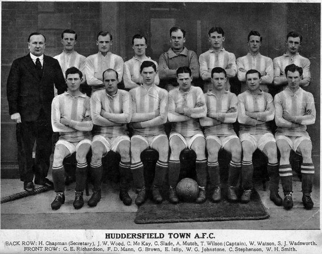 Chapman (standing far left), with the Huddersfield Town team of 1921–22, the season they first won the FA Cup.