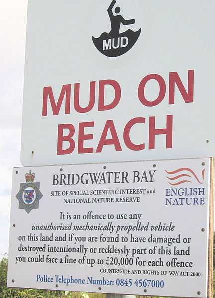 Mud danger signs on Bridgwater Bay near the mouth of the River Parrett are necessary because fast, high-amplitude tides here have led to drownings on 