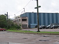 Burton factory in 2009, including double chairlift, originally used at a resort, between streetlights Burtonfactory.JPG