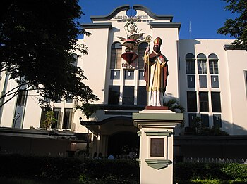 The school, with the statue of its Patron Sain...