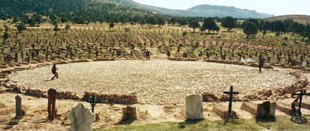 The iconic Mexican stand-off, with Tuco seen on the left, Angel Eyes in the middle, and Blondie on the right. The scene is accompanied by Ennio Morric