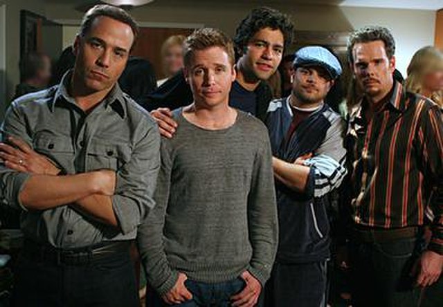The main characters of Entourage. From left to right: Ari Gold (Jeremy Piven), Eric "E" Murphy (Kevin Connolly), Vincent "Vince" Chase (Adrian Grenier