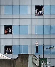 John Kirk-Anderson's photo of a person being abseiled from the Forsyth Barr Building became one of the enduring photos of the 2011 Christchurch earthquake John Kirk-Anderson - Forsyth Barr.jpg