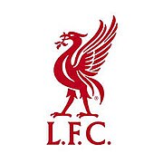 The words "Liverpool Football Club" are in the centre of a pennant, with flames either side. The words "You'll Never Walk Alone" adorn the top of the emblem in a green design, "EST 1892" is at the bottom