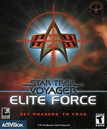 Superimposed over a space background, a set of crosshairs rest over a delta-shaped insignia. Below the insignia, in a futuristic black typeface, are the words "Star Trek: Voyager". Lower down, the words "ELITE FORCE" are written in a similar but larger, white typeface.