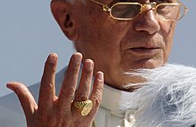 Pope Benedict XVI wearing his papal ring in 2005 Benedict XVI Fisherman Ring.jpg