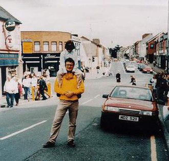 The red Vauxhall Cavalier containing the bomb. This photograph was taken shortly before the explosion; the camera was found afterwards in the rubble. 