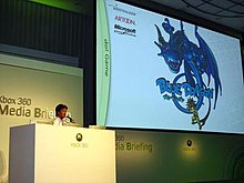 Hironobu Sakaguchi giving a presentation on Blue Dragon at the 2006 Tokyo Game Show convention. Sakaguchibluedragon.jpg