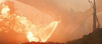 The 2019 biopic Tolkien links the Great War to Middle-earth by showing Tolkien, in delirium, hallucinating a fire-breathing dragon from what may be a Flammenwerfer
in no-man's land. Tolkien Great War Flammenwerfer Dragon.jpg