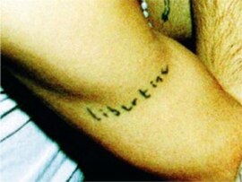 Carl Barât's tattoo of the word "Libertine" on his right arm (in Barât's own handwriting). Taken from the second album cover