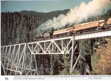 Vance Creek Bridge with a Simpson steam locomotive hauling timber, 1940