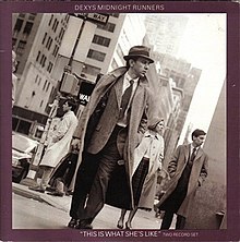Kevin Rowland, Helen O'Hara and Billy Adams, smartly dressed crossing a street in New York
