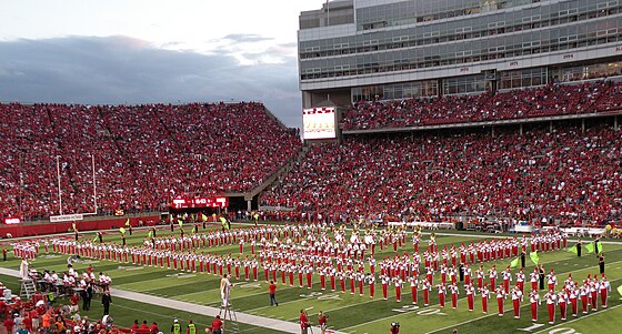 The Cornhusker Marching Band performing a halftime show in Memorial Stadium.