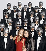 Bachelorette Hayley Arp (center-left) and host Monica Lewinsky (center-right) surrounded by Arp's masked suitors Mr. Personality Promotional Image.jpg