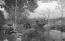 A vintage postcard view of the Paulins Kill at Baleville, in Hampton Township, New Jersey, circa 1905.  The Paulins Kill is a calm, slow-flowing river, without significant disturbance or rapids, and looks much like this view for all of its length.