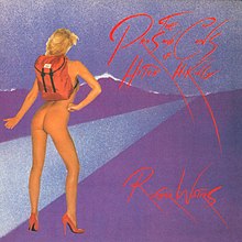 a nude back-view image of a blonde woman wearing a red backpack and red stilettos sticking her thumb out, her buttocks clearly visible.