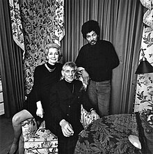 Composer Leonard Bernstein (seated) and his wife, Felicia Montealegre, with Black Panthers Field Marshal Donald L. Cox (right), at a fundraiser for the Black Panthers in January 1970 at the Bernsteins' apartment on Park Avenue in New York City. The photo appeared in the New York magazine article that spawned the term "radical chic". Felicia Montealegre and Leonard Bernstein with Donald L. Cox.jpg