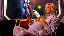 Future simulation: mother-to-be in space lounge wears a 2suit while relaxing. (The Universe, Sex in Space; History Channel) WomanSpaceLounge2Suit-M.jpg